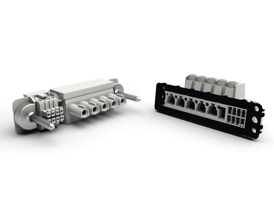 Fot. 2 Przykład hybrydowego przyłącza modułowego opartego o system Variocon firmy Phoenix Contact. Widoczne są metalowe piny pozycjonujące oraz czarna rama montażowa zapewniająca kompensację tolerancji.